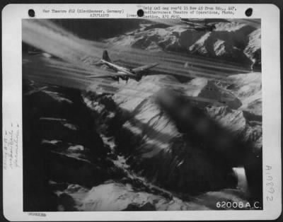 Thumbnail for Consolidated > Boeing B-17 Flying Fortresses Of The 15Th Af, En Route To Bomb Oil Refinery At Blechhammer, Germany, Leave Fleecy Vapor Trails.