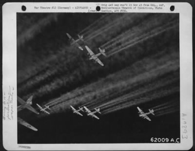 Thumbnail for Consolidated > Boeing B-17 Flying Fortresses Of The 15Th Af, Italy, Leave A Blanket Of Vapor Trails As They Fly High Above Their Target, The Oil Refinery At Regensburg, Germany.