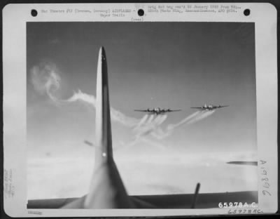 Thumbnail for Consolidated > Vapor Trails Stream From Boeing B-17 Flying Fortresses Of The 381St Bomb Group, Invading Enemy Skies To Attack Vital Installations At Bremen, Germany.