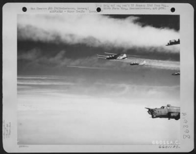 Thumbnail for Consolidated > Boeing B-17 Flying Fortresses Of The 381St Bomb Group Leave Trails In The Sky As They Drone Steadily On Toward Wilhelmshaven, Germany On 3 Feb 44 To Strike Again At Enemy Installations.