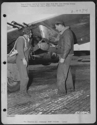 Thumbnail for Consolidated > Germany - In A Last Minute Check-Up, Lt. Merle D. Richey Dayton, Ohio, And Rockway Park, Nj, And A Ground Crewman Examine The Wing Schackle On Republic P-47 To Make Sure That The Bomb Is Fastened Securely.  A Veteran Of 46 Combat Missions, Lt. Richey Dest