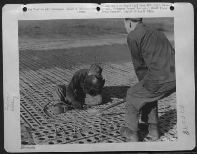 Thumbnail for Consolidated > Aviation Engineer Technicians Of The Ix Engineer Command Weld Overlapping Sections Of Steel Planking On The Runway Of An Airstrip In Germany.  The Field, One Of The First Allied Strips In The Reich, Will Be Used By 9Th Af Fighter Bombers.  Sgt. A.E. Selle