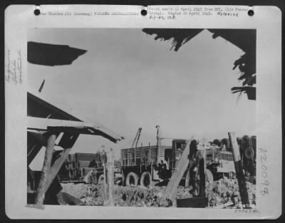 Thumbnail for Consolidated > Pictured Thru The Bombed Out Section Of A Former German Building Are Aviation Engineers Of The Ix Engineer Command Unloading Square Mesh Track Surfacing To Be Used In The Building Of An Airstrip In Germany For The Use Of 9Th Af Fighter-Bombers In Coordina