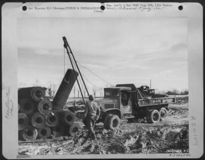 Thumbnail for Consolidated > Aviation Engineers Of The 9Th Engineer Command Lifting Steel Matting For An Airstrip In Germany.