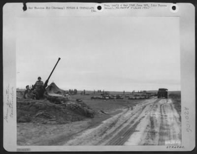 Thumbnail for Consolidated > Aviation Engineers Of The 9Th Engineer Command Laying A New American Airstrip On A Former Luftwaffe Base In Germany.  Anti-Aircraft Guns Set Up To Protect The Airstrip.