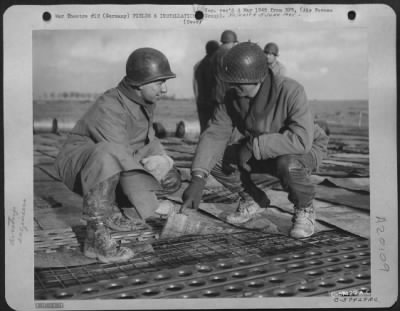 Thumbnail for Consolidated > Aviation Engineers Laying Steel Planks For An Airstrip On A Former German Base.