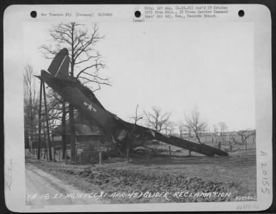 Thumbnail for Consolidated > Glider Reclamation -- Battered (G-4A) Glider Shown Somewhere In Germany, Is Mute Evidence Of The Less Fortunate Landings During The Rees-Wesel Airborne Invasion.  Two Weeks Time Was All That The Engineers Of The 82Nd Service Group, 9Th Troop Carrier Comma