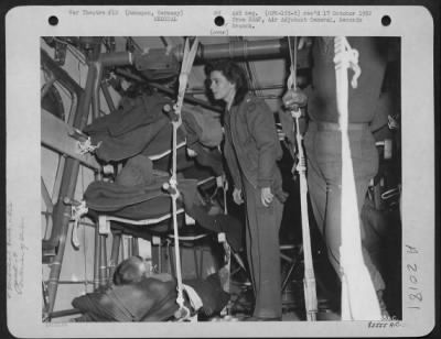 Consolidated > Flight Nurses Of The 9Th Troop Carrier Command Tends To Wounded Aboard Glider At Remagen, Germany Prior To Take Off.  22 March 1945.