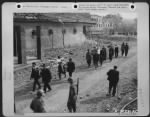 German Civilians Remove The Bodies Of Slave Workers From The Labor Camp Near Nordhausen, Germany As U.S. Soliders Supervise The Grisly Work.  Hundreds Of Workers Were Systematically Starved To Death By Their German Masters.  Photograph By A 9Th A.F. Camer - Page 1