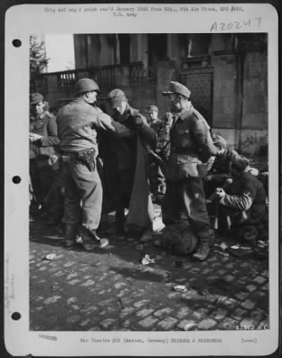 Thumbnail for Consolidated > German Prisoners Of War Being Searched By An American Solider Before Being Sent To The Prison Camps In The Rear.  Aachen, Germany.  28 Oct. 1944.