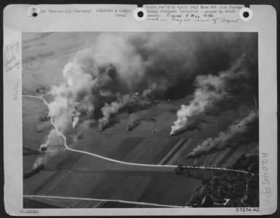 Consolidated > The Luftwaffe Coming Up -- In Smoke: More Than A Dozen Smoke Columns Caused By Burning German Aircraft Destroyed On The Ground Give Graphic Emphasis To The New Record Set On 16 April 1945 By Us 8Th Af Fighter Pilots -- 644 Enemy Planes Destroyed On The Gr