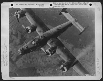 Thumbnail for Consolidated > The Number Four Engine (Far Left) Of 'Burma Bound' A Consolidated B-24 Liberator Of The 15Th Af, Was Hit By Flak As The Plane Returned From Blasting A Target At Munich, Germany.  It Limps Homeward On Three Engines.  December 1944, 451St Bomb Group.