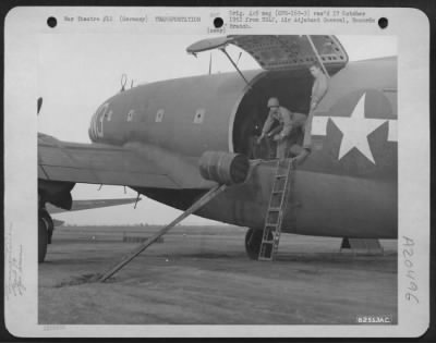 Thumbnail for Consolidated > The Us 7Th Army'S Call For Gasoline Is Answered With Action By Planes And Soliders Of The 9Th Troop Carrier Command As A Crew Member Sends A 40 Gallon Drum Of 100 Octane Gasoline Out Of The Plane On A Set Of Steel Rails At An Air Base Somewhere In Germany