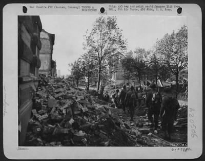 Thumbnail for Consolidated > Following A Preliminary Softening Up By Artillery Tank-Destroyers And 9Th Af Dive Bombers Yank Infantrymen Are Shown Advancing Into The City Of Aachen, Germany.