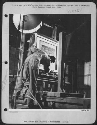 Thumbnail for Consolidated > The huge camera to the right, operated by Cpl. Paul C. Cronk, 537 Cypress Street, Yeadon, Pa., will photograph on to one sheet of film, the large mosaic made by pasting together strips of aerial photographs taken by the reconnaissance plane.