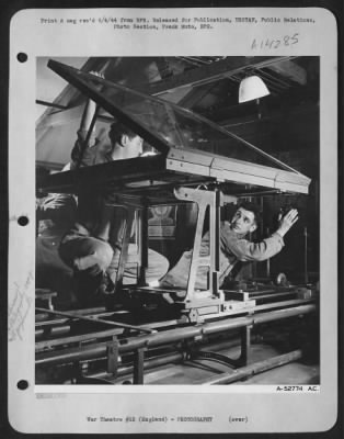 Thumbnail for Consolidated > Pvt. Louis J. Sumocker, Jr., 20, of 517-2nd Avenue NE, Oelwein, Iowa, (at left) and Cpl. Sidney Schawelson, 21, of 11917-111th Avenue, S. Ozone Park, N.Y., prepare the engraving plate for reproduction of a map made from the aerial reconnaissance