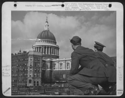 Thumbnail for Consolidated > London's famous St. Paul's cathedral amidst bombed buildings, a sight which these two yanks will long remember. (LR) Cpl. Graham T. Wheeler, Durham, North Carolina and Pvt. Frank H. Phillips, Utica, New York, London, England.