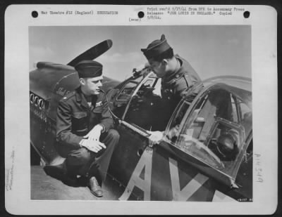 Thumbnail for Consolidated > JOE LOUIS IN ENGLAND.After putting on a boxing exhibition at an air base somewhere in England, world's champion Sgt. Joe Louis tries the cockpit of a North American P-51 for siz. Its pilot, Col. George Peck, Detroit, Michigan, gives the Champ a few