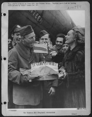 Thumbnail for Consolidated > The occasion is the 105th mission party of the U.S. Eighth Air force Boeing B-17 Flying ofrtress "Stage Door Canteen." M/Sgt. Clarence B. Bankston of Baton Rouge, La., crew chief of the "Stage Door Canteen," eats a piece of the planes cake given