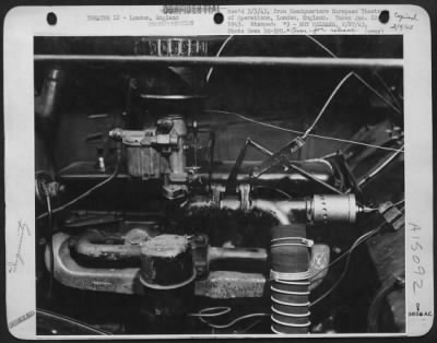 Thumbnail for Consolidated > THIS AIR MIXER IS FITTED TO CARBURETOR OF CAR, ALLOWING IT TO BURN PRODUCER GAS, A SUBSTITUTE WON FROM SAWDUST OR ANTHRACITE COAL. LONDON, ENGLAND.