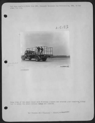 Thumbnail for Consolidated > Long view of the skeet truck with ofrtress gunners and mounted guns complete riding out to where the skeet release traps are located.