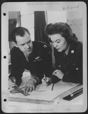 Thumbnail for Consolidated > Wacs in ETO fill a wide variety of positions, many of them vitally necessary to continued and growing operations against Nazi targets on the continent. Pvt. Mabel E. Powell is taking notes from Capt. Lawrence E. Godley, assistant training