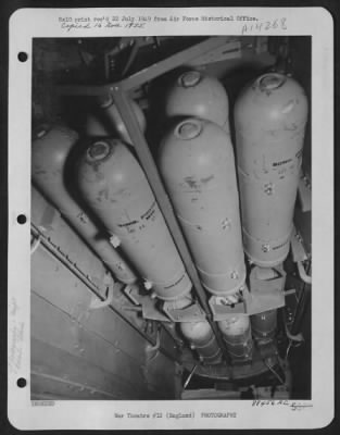 Thumbnail for Consolidated > England - The Bomb Bay, Filled With Flash Bombs Just Before The Take-Off For A Night Reconnaissance Mission Over Breteuil, France, By Lt. Colonel Leon Gray'S U.S. 8Th Air Force Reconnaissance Group.  The Fuses Are Specially Set So That They Will Explode I