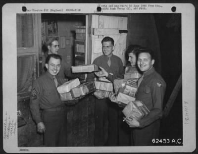 Thumbnail for Consolidated > Christmas Packages From Loved Ones At Home Bring Smiles Of Happiness To These Men Of The 863Rd Bomb Squadron, 493Rd Bomb Group, England.  24 November 1944.