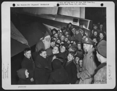 Thumbnail for Consolidated > Members Of The 493Rd Bomb Group Give English Children A Glimpse Of Old St. Nick At A Special Christmas Party Given At An U.S. Airbase In England, 22 December 1944.