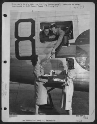 Consolidated > Not All Farewells Were Saddened By Tears Of Girl Friends Left Behind In England As American Soldiers Departed For Home.  These Two Members Of The U.S. 8Th Af Are Being Given A Cheery Send Off And Cigarettes On Their Homeward Flight By American Red Cross G