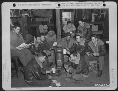 Thumbnail for Consolidated > Men Assigned To The Motor Pool Play Cards And Read In The Barracks During Off-Duty Hours.  401St Bomb Group, England, 25 March 1945.