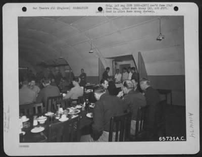 Thumbnail for Consolidated > Officers Of The 401St Bomb Group Enjoy A Well-Prepared Meal In The Dining Room Of The Officers' Club At An 8Th Air Force Base Near Deenethorpe, England.  23 November 1944.