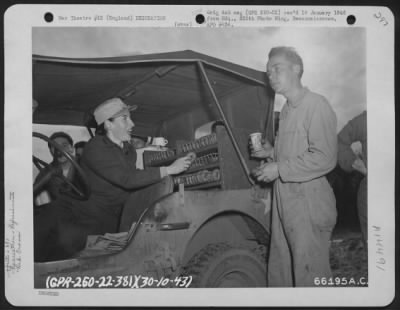 Thumbnail for Consolidated > Red Cross Worker Hands Out Doughnuts To Some Of The Men Of The 381St Bomb Group At 8Th Air Force Station 167 In England.  30 October 1943.