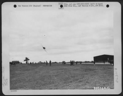 Thumbnail for Consolidated > A N.A. At-6 Of The 353Rd Fighter Group Buzzes The Field At An 8Th Air Force Base Where English Civilians And American Military Personnel Have Congregated To Observe The Exhibitions On Air Force Day On 1 March 1945.