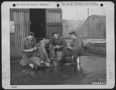 Consolidated > Lt. Colonel W. H. Juntilla Of The 352Nd Fighter Squadron, 353Rd Fighter Group, Lends A Hand In The Task Of Peeling Potatoes Along With Other Members Of The Group At Their Base In England.  November 1944.