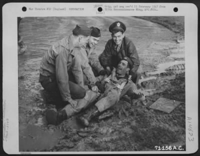 Consolidated > Indulging In A Bit Of Air Force Ritual, A Member Of The 379Th Bomb Group Gets A Dunking At The Hands Of Fellow Crew Members After Completing The Required Number Of Missions Over Enemy Territory.  England, 3 November 1943.