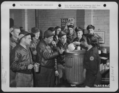 Thumbnail for Consolidated > Red Cross Worker Serves Coffee And Doughnuts To Members Of The 379Th Bomb Group At An Improvised Refreshment Stand In England.  5 January 1944.