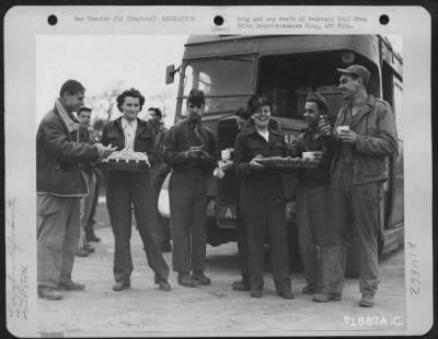 Thumbnail for Consolidated > Ground Personnel Of The 379Th Bomb Group Take Time Out From Their Duties To Enjoy Coffee And Doughnuts Served Them By American Red Cross Workers Of A Clubmobile Unit On 10 January 1943.  England.