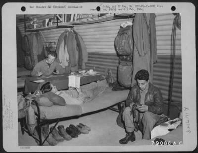 Thumbnail for Consolidated > Relaxing In The Quarters Are These Members Of A Liberator Crew Named "Night Raider".  Playing Solitaire Is S/Sgt. Stephen L. Hegedua, Milwaukee, Wisc. Tail Gunner; S/Sgt. James V. Roberts, Waverly, Iowa., Turret Gunner Is Reading And S/Sgt. Richard L. Gue