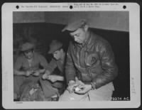 Thumbnail for S/Sgt. Maynard H. Smith Of Caro, Mich., A Member Of The 423Rd Bomb Squadron, 306Th Bomb Group And A Congressional Medal Of Honor Recipient, Tries His Skill At Peeling Pototes At His Base In England.  Sgt. Smith Received The Award For Extinguishing The Fir - Page 1