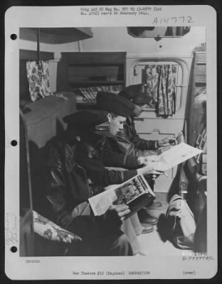 Thumbnail for Consolidated > 2Nd Lt. Kenneth Murphy Of Kittyhawk, Nc, 2Nd Lt. William A. Pratt Of Lorain, Ohio And 2Nd Lt. Murray Markowitz Of New York City Read The Latest Magazines And Papers And Enjoy Free Cigarettes In The Club Room Built In The Rear Of The Red Cross Clubmobile A