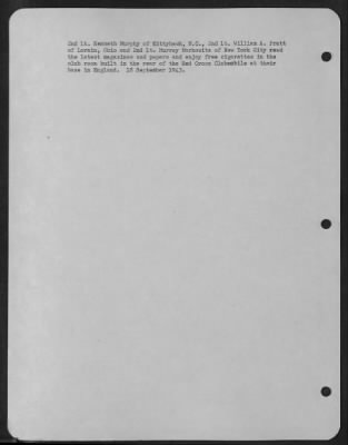 Thumbnail for Consolidated > 2Nd Lt. Kenneth Murphy Of Kittyhawk, Nc, 2Nd Lt. William A. Pratt Of Lorain, Ohio And 2Nd Lt. Murray Markowitz Of New York City Read The Latest Magazines And Papers And Enjoy Free Cigarettes In The Club Room Built In The Rear Of The Red Cross Clubmobile A