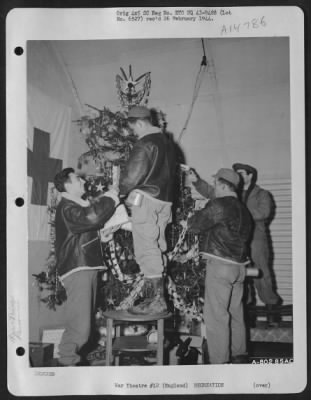 Thumbnail for Consolidated > Left To Right: Cpl. Michael J. Sabagh Of Lawrence, Mass., Pvt. Larry H. James Of Campbellsville, Ky., Cpl. Goldmer S. Elkins Of Cyclone, Wv, And Cpl. Thomas Hallingam Of Pittsburgh, Pa., Trim A Christmas Tree For A Party Given For Homeless Children Somewh