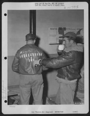 Thumbnail for Consolidated > Warming Up After A Safe Return From A Raid On Norway, Is S/Sgt. Frank C. Rumberger Of Johnston, Pa., While S/Sgt. Peter Kucher Of Pittsburgh, Pa., Enjoys His Coffee And Admires Sgt. Rumberger'S Jacket.  Both Are Crew Members Of The Boeing B-17 'Lucifer, J