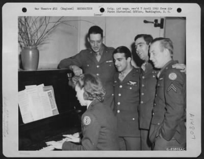 Thumbnail for Consolidated > Members Of The 458Th Bomb Group Join A Red Cross Worker In A Song Fest At An 8Th Air Force Base Somewhere In England.