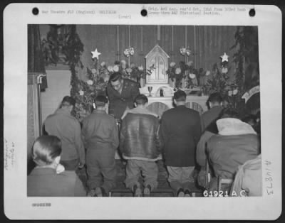 Thumbnail for Consolidated > Christmas Services - Personnel Of The 303Rd Bomb Group Receive The Sacrament Of Holy Communion At An Airbase Somewhere In England.  26 December 1944.