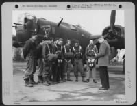 Capt. James A. Burrsi, Chaplain, Leads Ground And Flight Crews Of The Consolidated B-24 'The Lonesome Polecat' In Prayer, Before They Take Off On A Mission Over Europe, At An Airbase In Hardwick, England.  31 January 1944. - Page 1