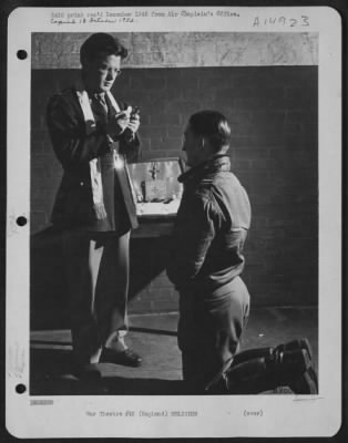 Consolidated > Lt. Colonel Francis E. Gabreski, Tied For American Fighter Record With 27 Kills To His Credit, Kneels Before Catholic Chaplain John Mcgettigan Of Philadelphia, Penn., As He Receives Holy Communion Immediately After Briefing Prior To Take-Off On A Mission