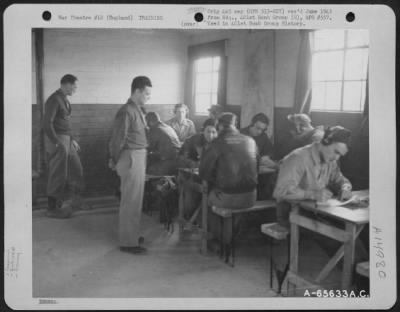 Thumbnail for Consolidated > 2Nd Lt. Leslye Winchester Supervises Radio Operators Of The 401St Bomb Group In Their Practice In Receiving And Transmitting Messages.  Only Those Who Proved Themselves Able To Log The Messages Accurately Were Eligible For Combat Flying.  England, 25 Febr