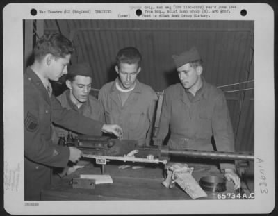 Thumbnail for Consolidated > Gunnery Instruction At The 401St Bomb Group Base Was Constant And Careful.  Here, T/Sgt. J.D. Disskon, T/Sgt. T.R. Stokesberry And Two Unidentified Men Work With The .50 Cal. Machine Gun.  England, 22 October 1944.